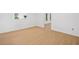 Bright bedroom featuring hardwood floors and a window with exterior views at 1575 Wynridge Pointe, Alpharetta, GA 30005