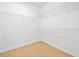 Walk-in closet with white walls, light wood floor, and installed wire shelving at 1575 Wynridge Pointe, Alpharetta, GA 30005