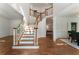 Bright foyer featuring hardwood floors, a staircase, and elegant finishes at 1575 Wynridge Pointe, Alpharetta, GA 30005
