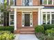 Elegant front door with sidelights and manicured landscaping for enhanced curb appeal at 1575 Wynridge Pointe, Alpharetta, GA 30005