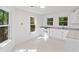 Bright kitchen featuring white cabinets and countertops, and multiple windows at 1575 Wynridge Pointe, Alpharetta, GA 30005
