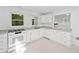 Renovated kitchen with white cabinets, stainless appliances, and granite countertops at 1575 Wynridge Pointe, Alpharetta, GA 30005