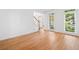Bright living room boasts hardwood floors and natural light from large windows at 1575 Wynridge Pointe, Alpharetta, GA 30005