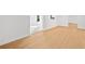 Living room with light wood floor and multiple entryways at 1575 Wynridge Pointe, Alpharetta, GA 30005