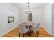 Charming dining room with a round wooden table, elegant chairs, and decorative chandelier lighting at 1634 Glenwood Se Ave, Atlanta, GA 30316