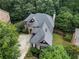 Beautiful aerial view of the home showcasing the roof, yard, and landscaping at 5355 Highland Pine Ln, Mableton, GA 30126