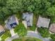 Stunning aerial view of the property surrounded by mature trees in a quiet neighborhood at 5355 Highland Pine Ln, Mableton, GA 30126