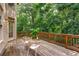 Spacious wooden back deck with lush green backyard and comfortable seating at 5355 Highland Pine Ln, Mableton, GA 30126