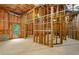Unfinished basement featuring framing and a window allowing natural light at 5355 Highland Pine Ln, Mableton, GA 30126