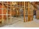 Unfinished basement featuring framing and a window allowing natural light at 5355 Highland Pine Ln, Mableton, GA 30126