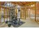 Unfinished basement with home gym setup and exposed insulation at 5355 Highland Pine Ln, Mableton, GA 30126