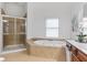 Bathroom featuring a large soaking tub, stand up shower and tile floors at 5355 Highland Pine Ln, Mableton, GA 30126