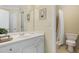 Bright bathroom featuring a white vanity with a single sink and a shower-tub combo at 5355 Highland Pine Ln, Mableton, GA 30126