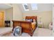 Bedroom with natural light, sleigh bed, carpet, and neutral colored walls at 5355 Highland Pine Ln, Mableton, GA 30126