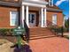 Clubhouse entrance with brick steps, iron railings, and a 'Members Only' sign at 5355 Highland Pine Ln, Mableton, GA 30126