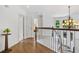Bright hallway features a chandelier, wooden staircase, and hardwood floors at 5355 Highland Pine Ln, Mableton, GA 30126