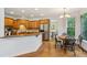 The kitchen features wood cabinets, modern appliances, and adjoins a sunny breakfast nook at 5355 Highland Pine Ln, Mableton, GA 30126