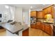 An expansive kitchen with wooden cabinets, stainless steel appliances, and a breakfast bar at 5355 Highland Pine Ln, Mableton, GA 30126