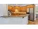 A spacious kitchen featuring stainless steel appliances and light wood cabinetry at 5355 Highland Pine Ln, Mableton, GA 30126