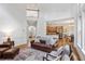 Open-concept living space with hardwood floors, adjoined kitchen, and expansive staircase at 5355 Highland Pine Ln, Mableton, GA 30126