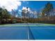 Well-maintained tennis courts surrounded by lush trees, perfect for sports enthusiasts at 5355 Highland Pine Ln, Mableton, GA 30126