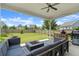 Relaxing outdoor space featuring a covered patio with comfortable seating and a grill, overlooking the well-maintained backyard at 876 Samples Nw Ln, Atlanta, GA 30318