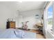 Inviting bedroom with hardwood flooring, lots of natural light, and an area for desk at 876 Samples Nw Ln, Atlanta, GA 30318