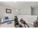 This room has a couch and gaming setup, featuring neutral walls and plush carpet at 876 Samples Nw Ln, Atlanta, GA 30318