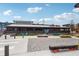Exterior view of the Chattahoochee Food Works with benches and chairs at 876 Samples Nw Ln, Atlanta, GA 30318
