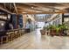 Modern bar area with marble countertops, gold-colored stools, and open walkway beyond at 876 Samples Nw Ln, Atlanta, GA 30318