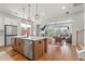 Open floor plan showcases a stylish kitchen island with stainless steel appliances and seating at 876 Samples Nw Ln, Atlanta, GA 30318