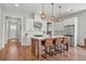 Gourmet kitchen with stainless steel appliances, an island with seating, and a breakfast bar at 876 Samples Nw Ln, Atlanta, GA 30318