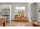 Bright kitchen with stainless steel refrigerator and a view of the backyard at 876 Samples Nw Ln, Atlanta, GA 30318