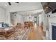 Open concept living room with kitchen view and hardwood floors throughout at 876 Samples Nw Ln, Atlanta, GA 30318