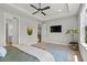 Spacious bedroom with modern ceiling fan, neutral color palette, and carpeted flooring at 876 Samples Nw Ln, Atlanta, GA 30318