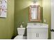 Charming powder room featuring a modern vanity and unique wall color at 876 Samples Nw Ln, Atlanta, GA 30318