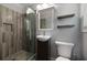 Bathroom featuring new vanity, glass shower, grey tile, and modern sink and toilet at 159 Lloyd Dr, Marietta, GA 30066