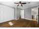 Bedroom with hardwood floors, a ceiling fan, and an ensuite bathroom at 159 Lloyd Dr, Marietta, GA 30066