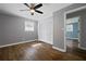 Neutral bedroom with ceiling fan, hardwood floors, and walk-in closet at 159 Lloyd Dr, Marietta, GA 30066
