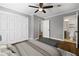 Bedroom with ceiling fan, hardwood floors, and closet leading to an ensuite bathroom at 159 Lloyd Dr, Marietta, GA 30066