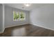 Cozy bedroom with hardwood floors, natural light, and a calming neutral color palette at 159 Lloyd Dr, Marietta, GA 30066