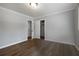 This bedroom features light gray paint, crown molding, dark hardwood floors, and a closet at 159 Lloyd Dr, Marietta, GA 30066