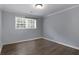 This bedroom features light gray paint, crown molding, and a window with a backyard view at 159 Lloyd Dr, Marietta, GA 30066