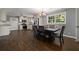 Open-concept dining area featuring tile flooring, neutral walls, and modern lighting at 159 Lloyd Dr, Marietta, GA 30066