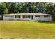 Charming single-story home with a well-manicured lawn, white brick facade, and blue shutters at 159 Lloyd Dr, Marietta, GA 30066