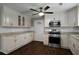 Charming kitchen featuring white cabinets, granite countertops, and stainless steel appliances at 159 Lloyd Dr, Marietta, GA 30066