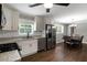 Bright eat-in kitchen with white cabinets, stainless steel appliances and tile backsplash at 159 Lloyd Dr, Marietta, GA 30066