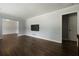Inviting living room with hardwood floors, gray walls, white trim and a wall-mounted TV at 159 Lloyd Dr, Marietta, GA 30066