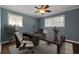 This home office features hardwood floors, natural light and a ceiling fan at 159 Lloyd Dr, Marietta, GA 30066