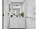 Bright bathroom with a modern vanity, stylish lighting, and a large mirror at 1445 Woodhill Dr, Marietta, GA 30066